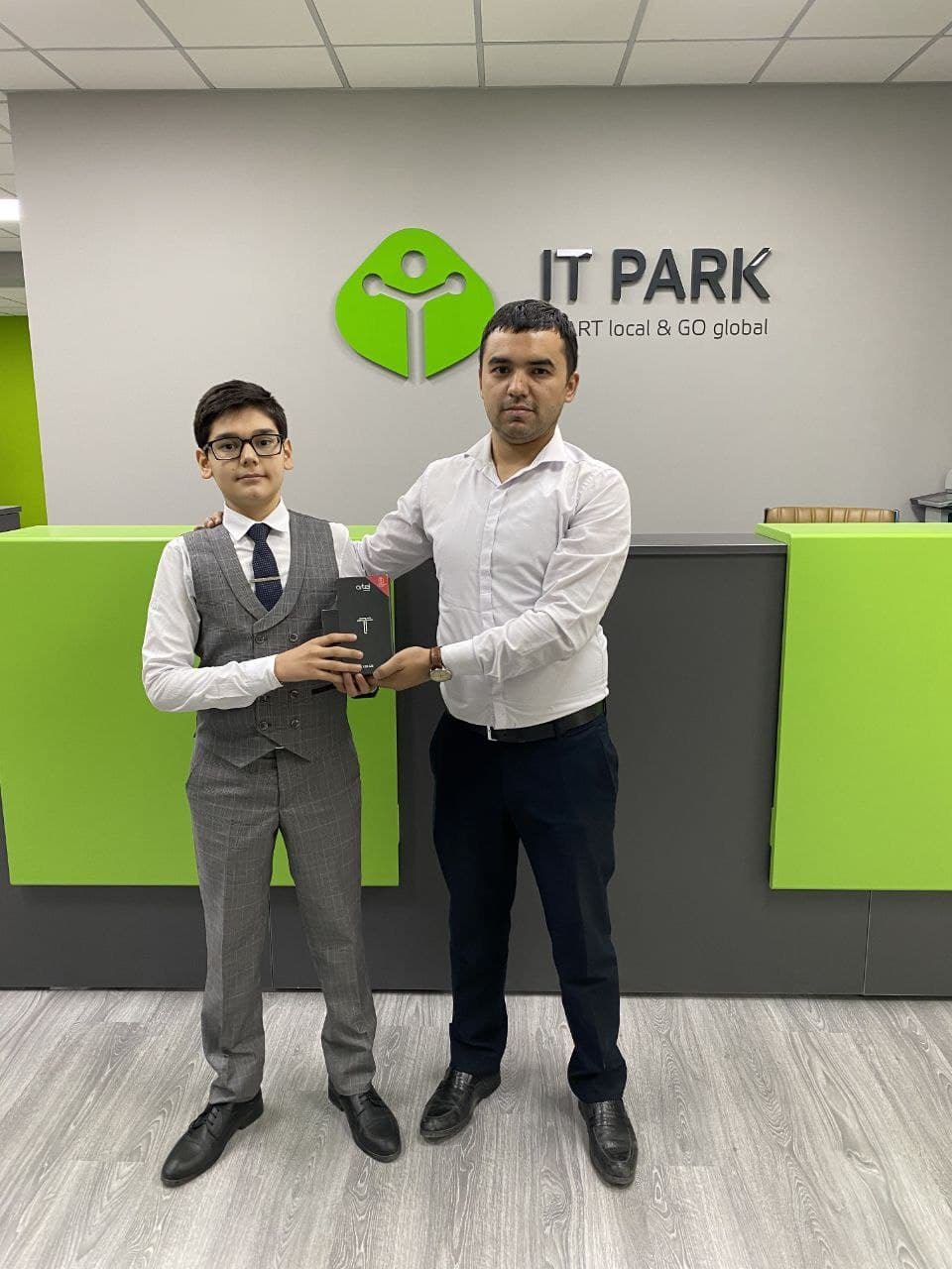 Asadbek receiving FutureSkills Uzbekistan robotics prize at IT Park